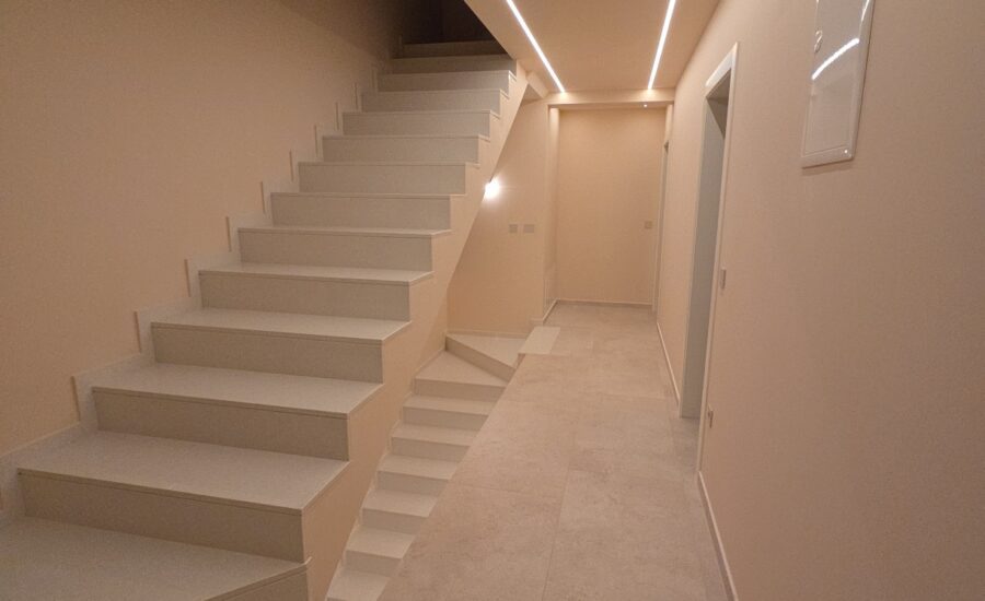 Modern villa interior staircase with minimalist design and LED ceiling lighting in Baderna near Poreč